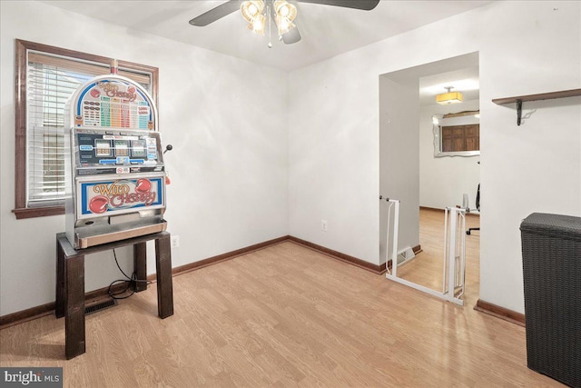 interior space with ceiling fan and light hardwood / wood-style flooring