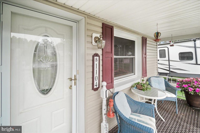 property entrance with covered porch