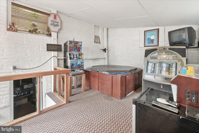 carpeted home office featuring lofted ceiling