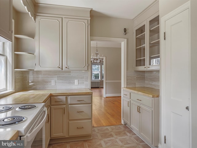 120 E Irvin Ave, Hagerstown, MD 21742 - kitchen featuring radiator, an inviting chandelier, electric range, wood counters, and open shelves