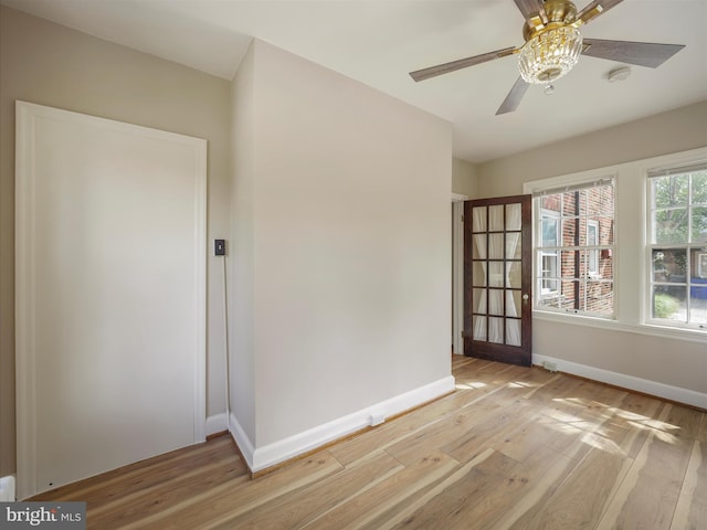 interior space with light wood-type flooring and ceiling fan