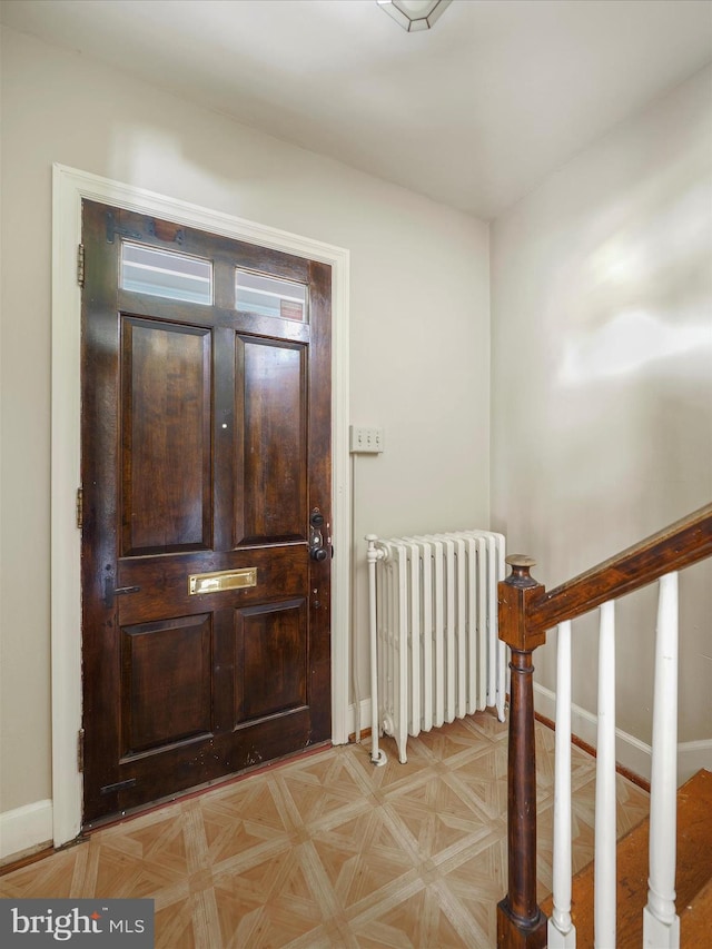 entryway featuring radiator heating unit