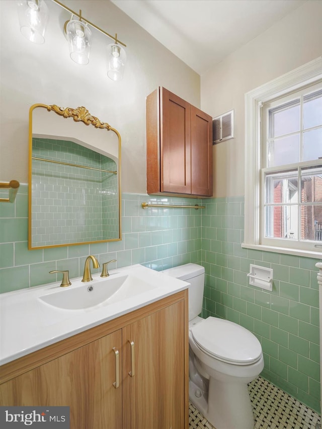 120 E Irvin Ave, Hagerstown, MD 21742 - bathroom with visible vents, toilet, tile walls, wainscoting, and vanity