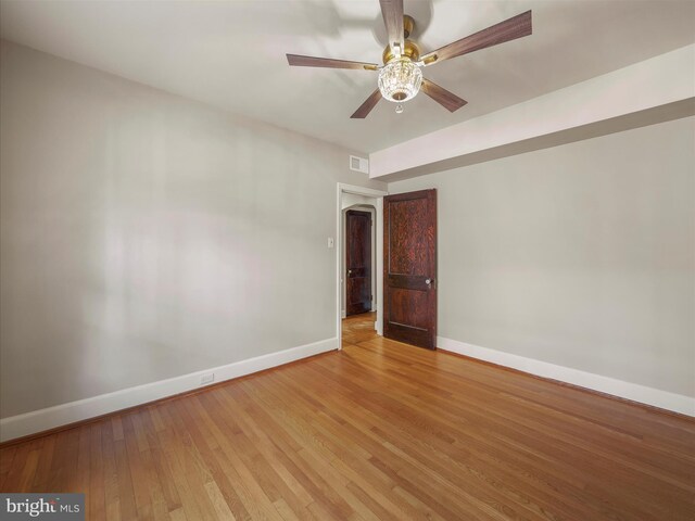 spare room featuring ceiling fan and light hardwood / wood-style flooring