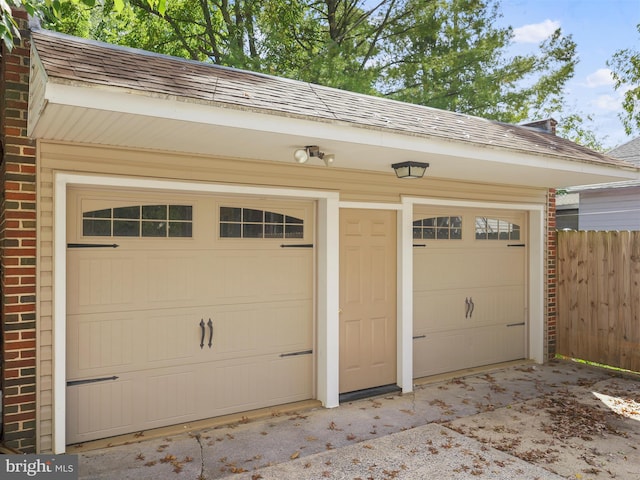 garage featuring wood walls