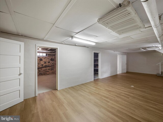 basement with wood-type flooring