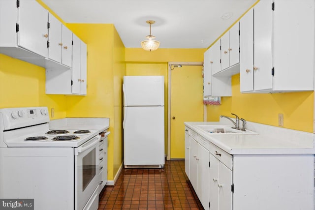 kitchen featuring pendant lighting, sink, white appliances, and white cabinetry