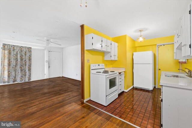 kitchen with white cabinetry, white appliances, ceiling fan, dark hardwood / wood-style floors, and sink