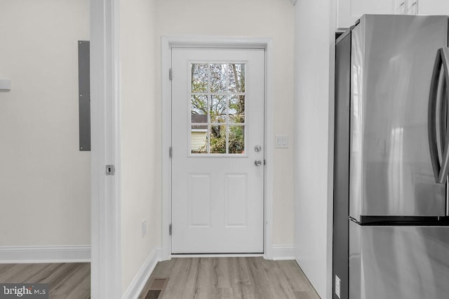 doorway with light hardwood / wood-style flooring