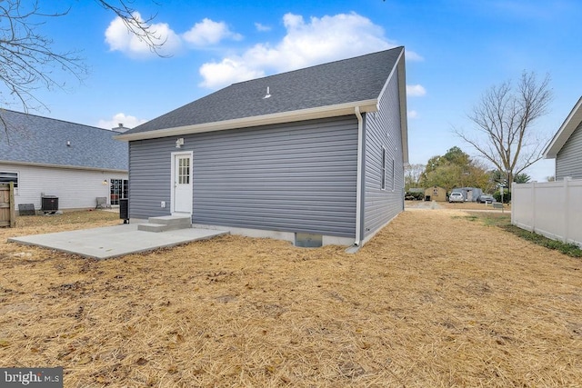 rear view of property with central AC and a patio area