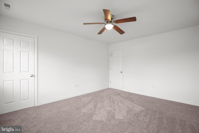 carpeted empty room with ceiling fan