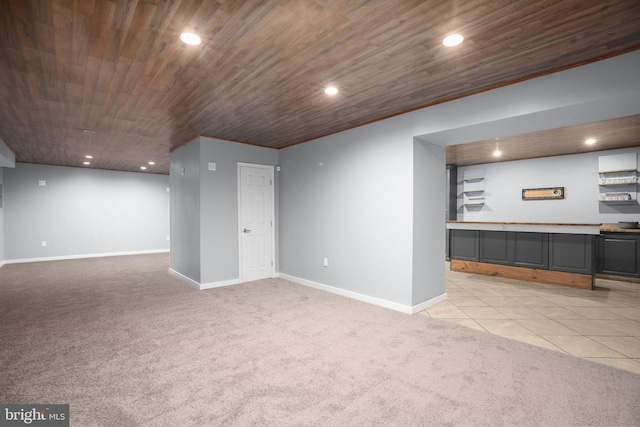 basement featuring light colored carpet and wood ceiling