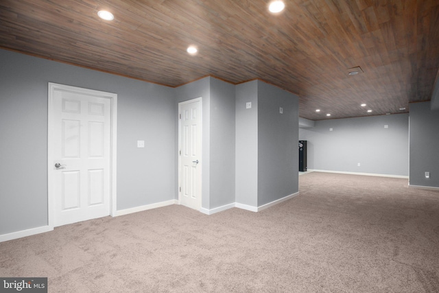 interior space featuring carpet flooring and wooden ceiling