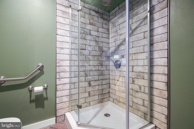 bathroom with a shower with shower door