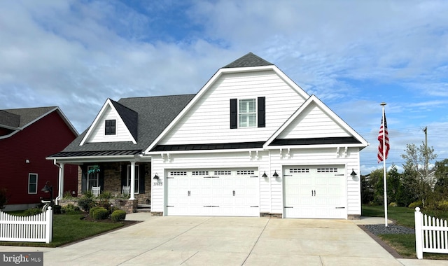 view of front of property featuring a garage and a porch