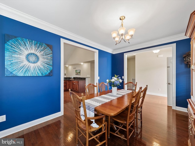 dining space featuring a notable chandelier, crown molding, and dark wood-type flooring