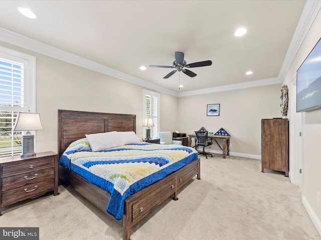 carpeted bedroom with multiple windows, ceiling fan, and crown molding