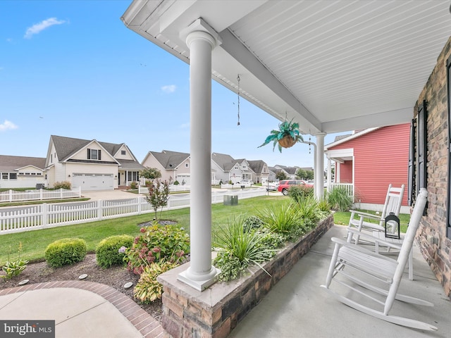 view of patio with a garage and covered porch