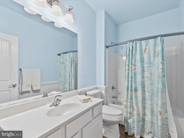 full bathroom with vanity, toilet, and shower / tub combo with curtain