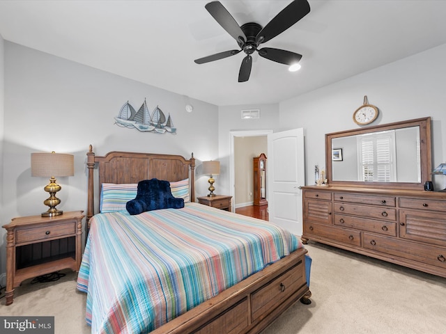 bedroom with ceiling fan and light colored carpet