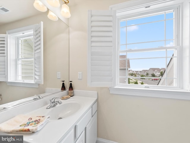 bathroom featuring vanity and a healthy amount of sunlight