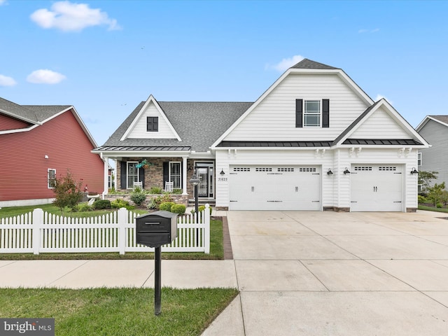 view of front of property featuring covered porch and a garage