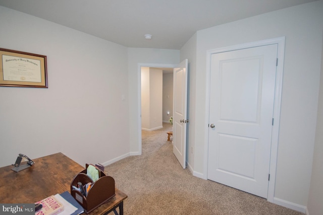 office area featuring light colored carpet