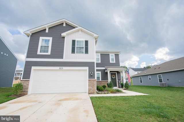 view of front facade featuring a garage, a front lawn, and central AC