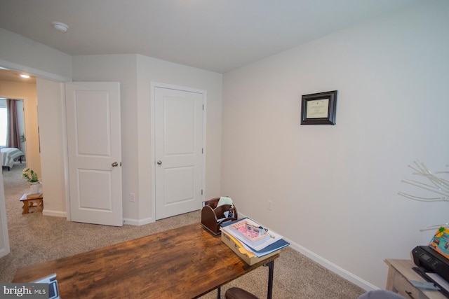 home office with carpet flooring