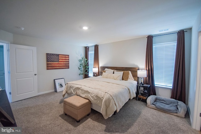 bedroom with light colored carpet