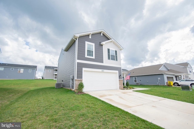 view of front of house featuring a front yard, cooling unit, and a garage