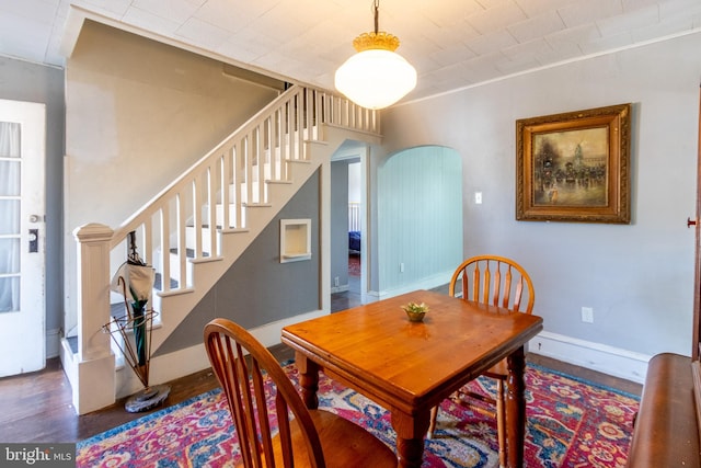 dining room with dark wood-type flooring