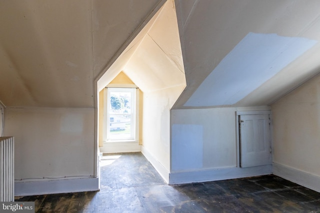 bonus room featuring vaulted ceiling