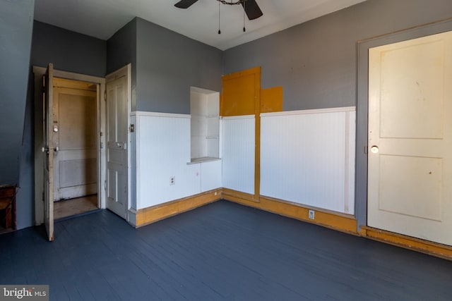 unfurnished bedroom featuring dark wood-type flooring