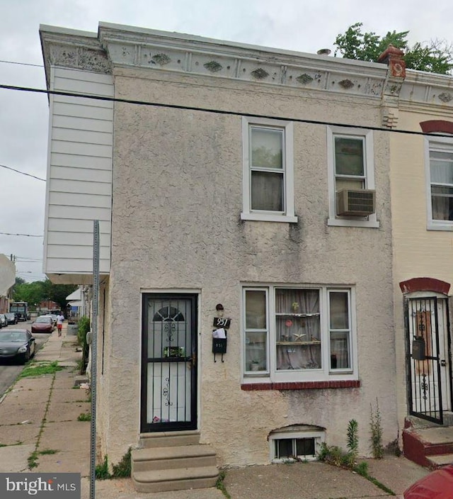 view of front of home featuring cooling unit