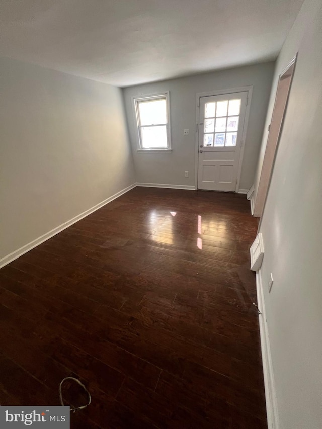 spare room featuring dark hardwood / wood-style flooring