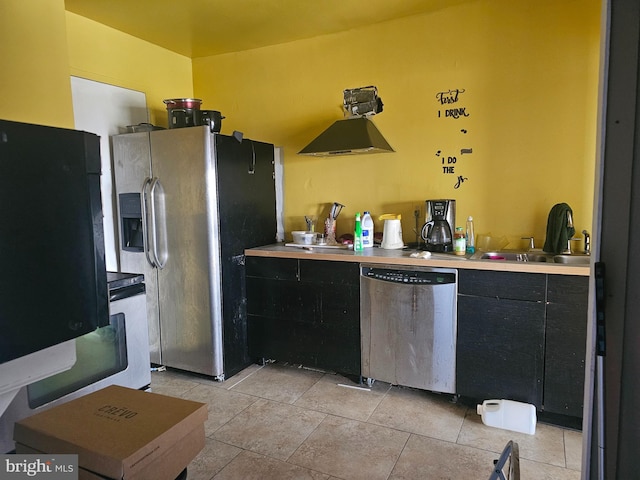 6606 Park Heights Ave Unit 905, Baltimore, MD 21215 - kitchen featuring stainless steel appliances, a sink, light countertops, light tile patterned flooring, and dark cabinetry