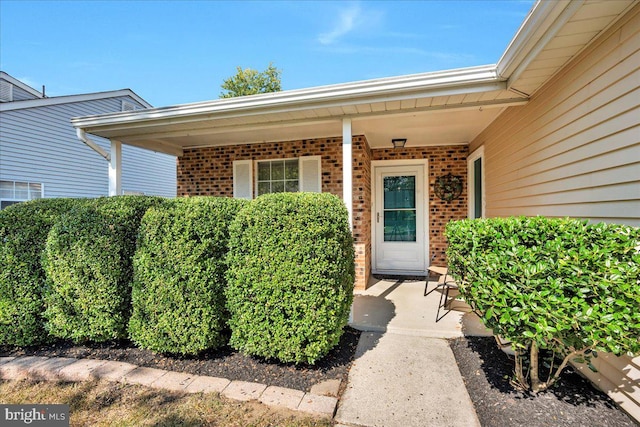 doorway to property featuring a porch