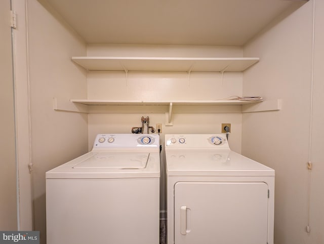 laundry area with independent washer and dryer