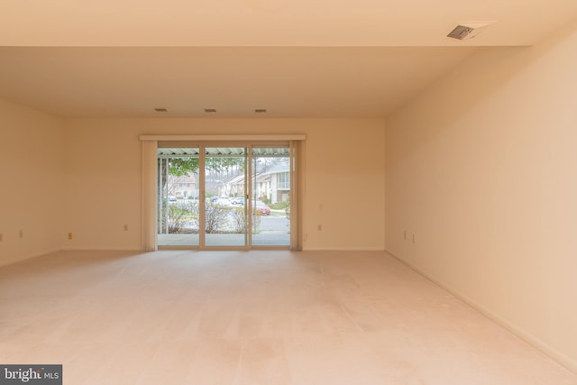 spare room featuring carpet flooring