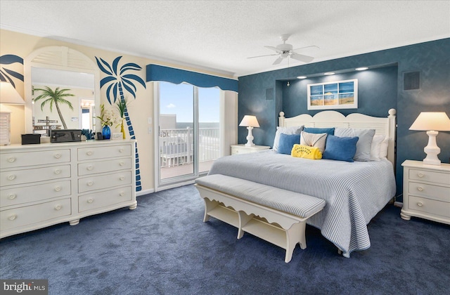 bedroom featuring a textured ceiling, access to outside, dark colored carpet, and ceiling fan