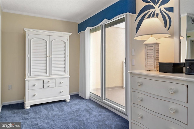 interior space featuring dark carpet, a textured ceiling, and crown molding