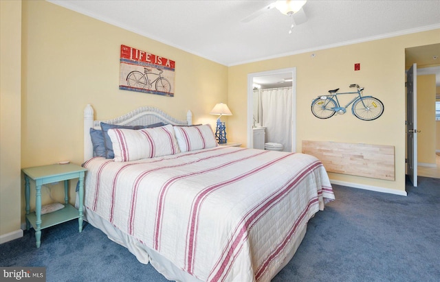 carpeted bedroom with connected bathroom, ornamental molding, and ceiling fan