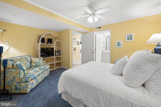 bedroom featuring crown molding, ensuite bath, ceiling fan, and dark colored carpet