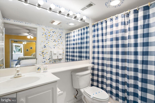 bathroom with ceiling fan, vanity, and toilet