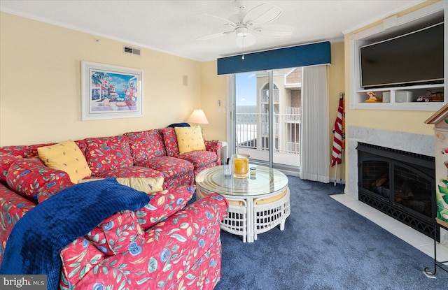 carpeted living room featuring ceiling fan