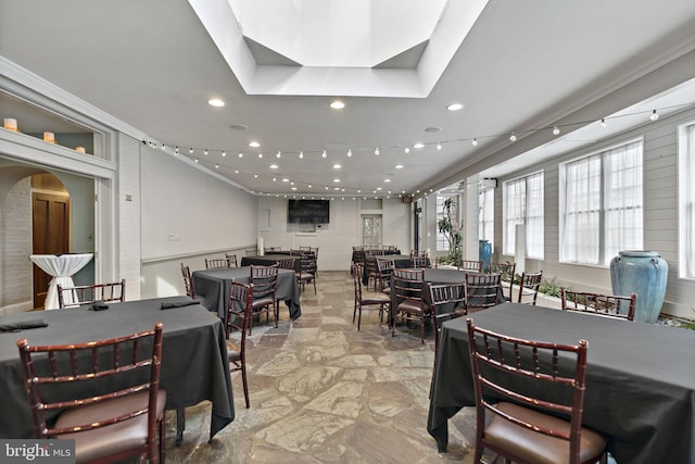 dining area featuring crown molding