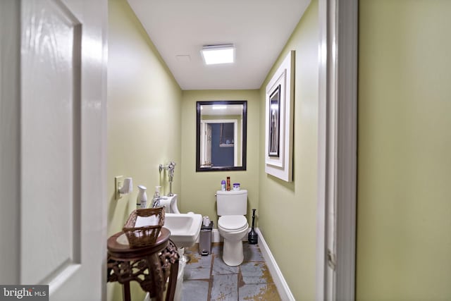 bathroom featuring toilet