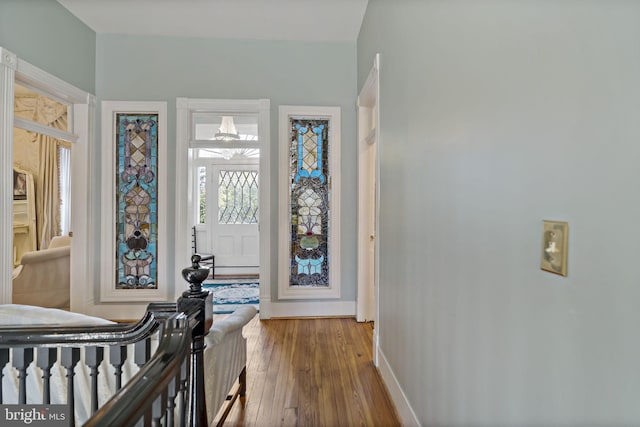 foyer entrance with hardwood / wood-style flooring