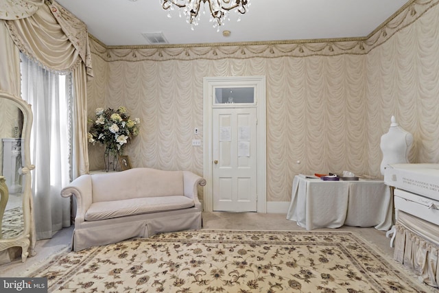 living area featuring a chandelier and carpet floors